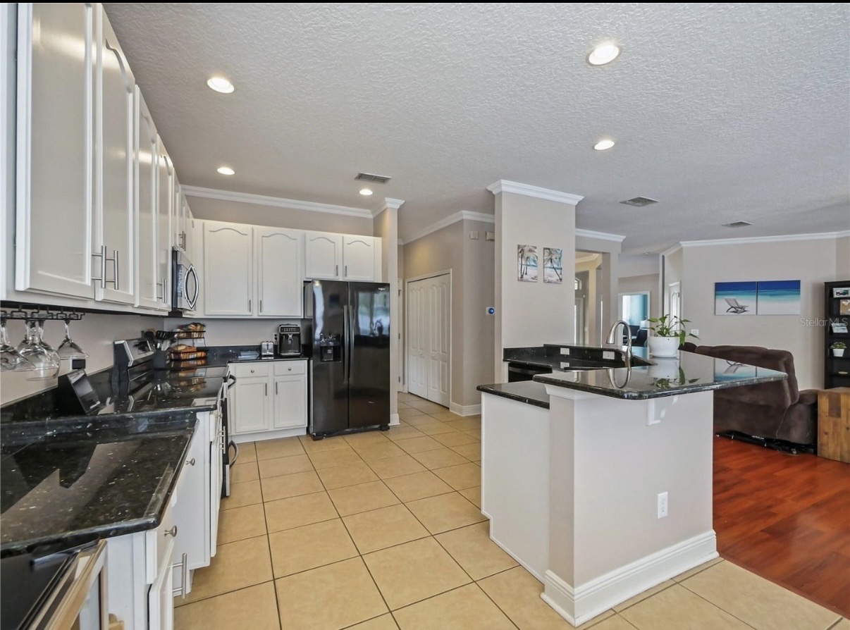 Kitchen — wide view with island & breakfast bar